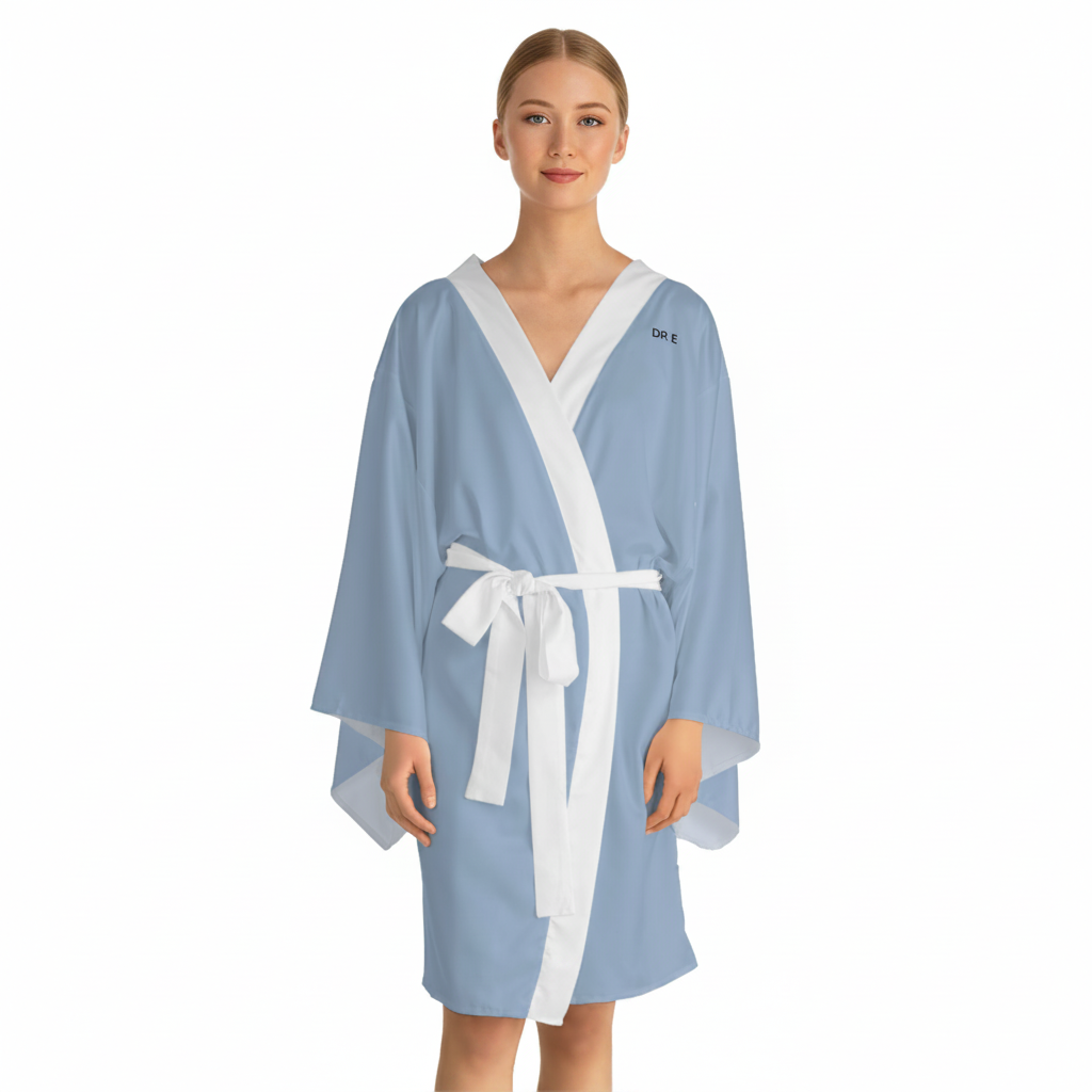 A woman modeling a light blue kimono-style robe with white trim and a white tie belt, shown against a plain white background.