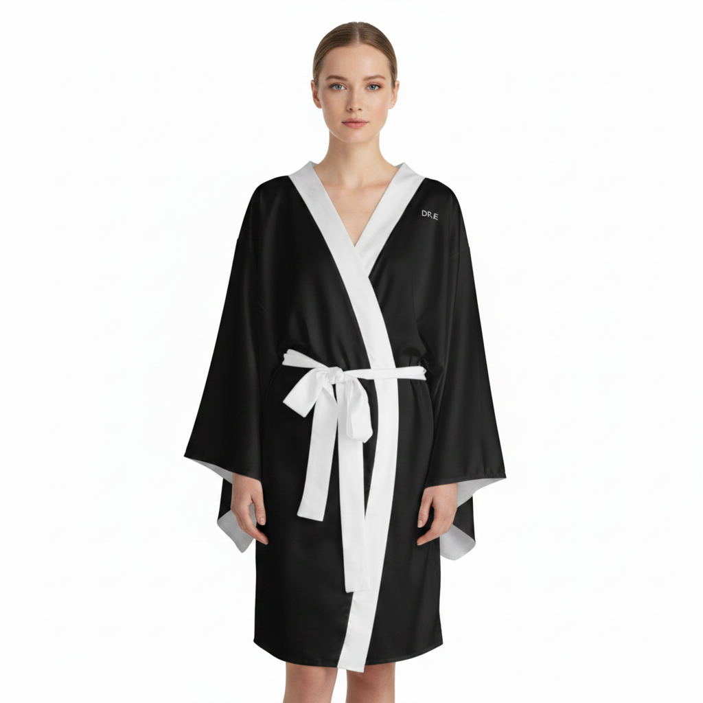 Woman wearing a black and white robe on a white background
