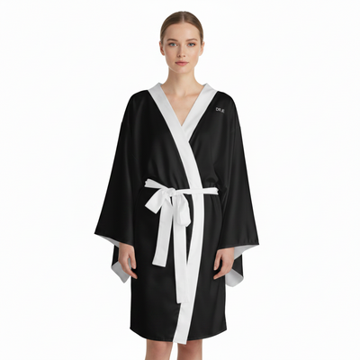 Woman wearing a black and white robe on a white background