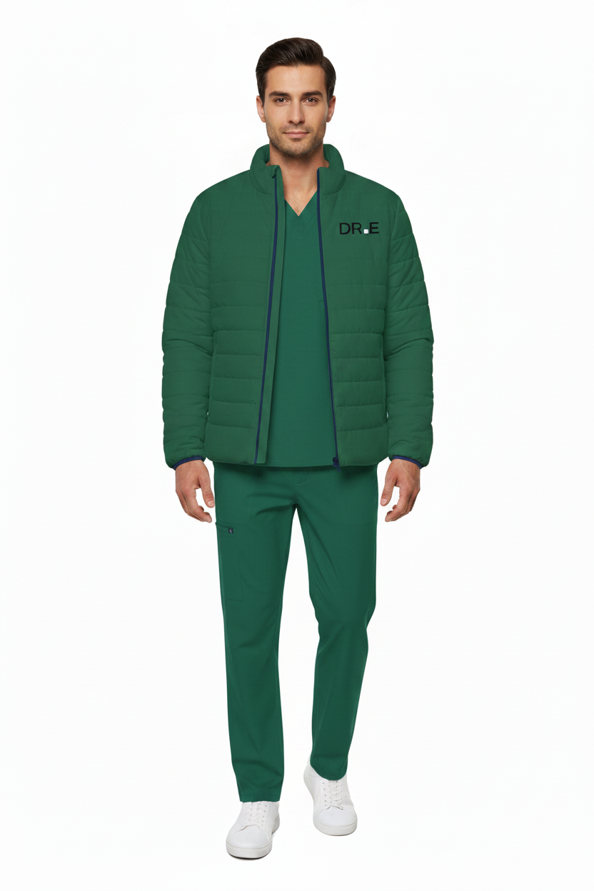A man modeling a matching green scrub set consisting of a zip-up puffer jacket with a black 'DR.E' logo on the chest, a matching green scrub top, and green scrub pants, paired with white sneakers against a plain white background.